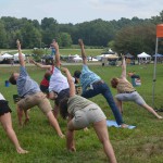 Festival-goers participate in free yoga